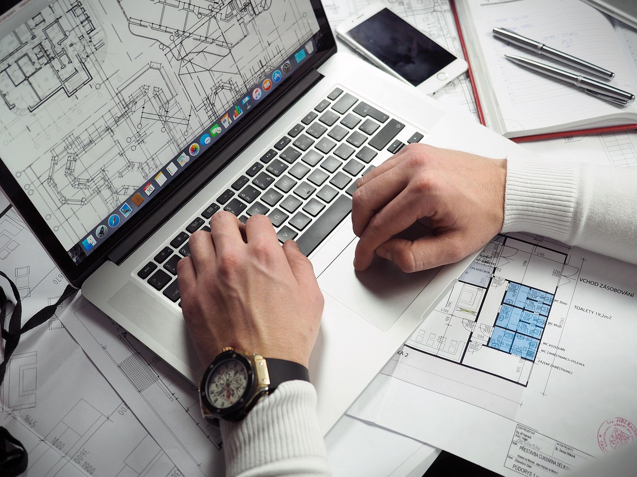 Blueprints, entrepreneur, hands — Converting TIFF to PDF: Your Online File Transformation Guide