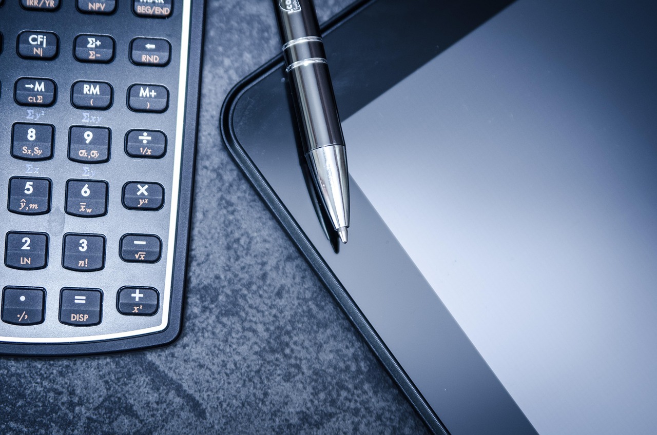Tablet, calculator, business — Revitalize Your Senses with Nuro Massage in London